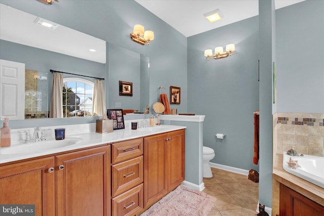 bathroom with toilet, dual bowl vanity, tile flooring, and a bathtub