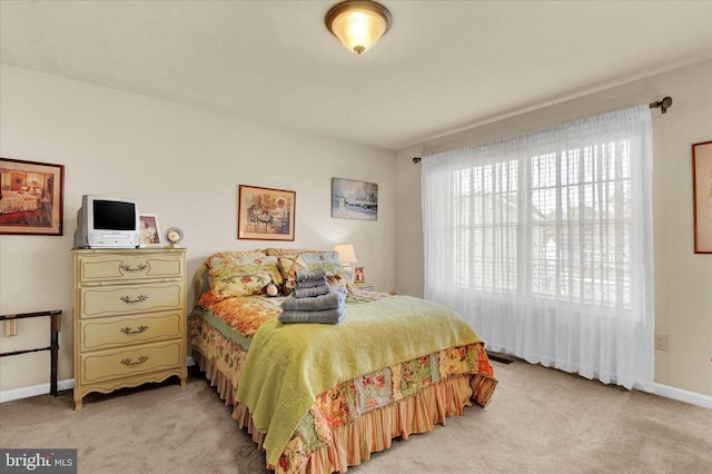 bedroom with light carpet