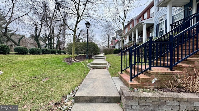 surrounding community with a lawn