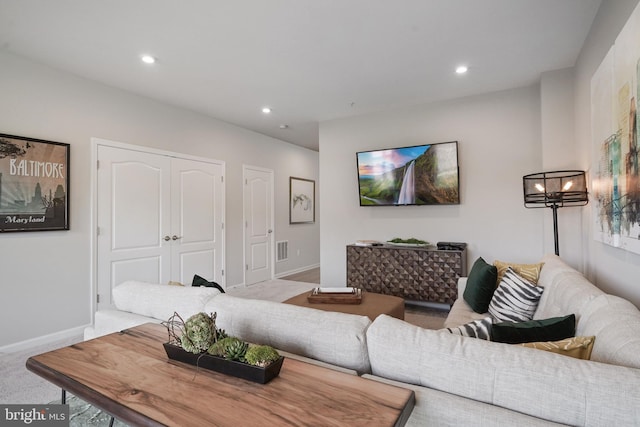 living room featuring light colored carpet