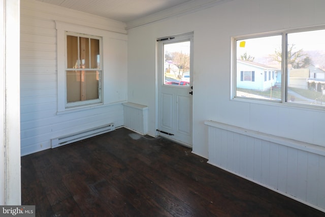 interior space featuring ornamental molding, a baseboard heating unit, radiator, and dark hardwood / wood-style floors