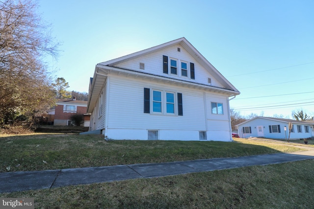 view of side of home featuring a yard