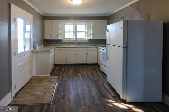 kitchen with white appliances, crown molding, white cabinetry, sink, and dark hardwood / wood-style flooring