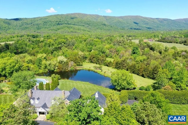 drone / aerial view with a water and mountain view