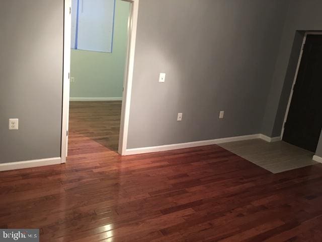 empty room featuring dark hardwood / wood-style floors