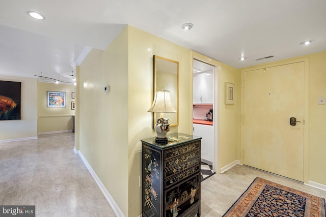 foyer entrance featuring light tile floors