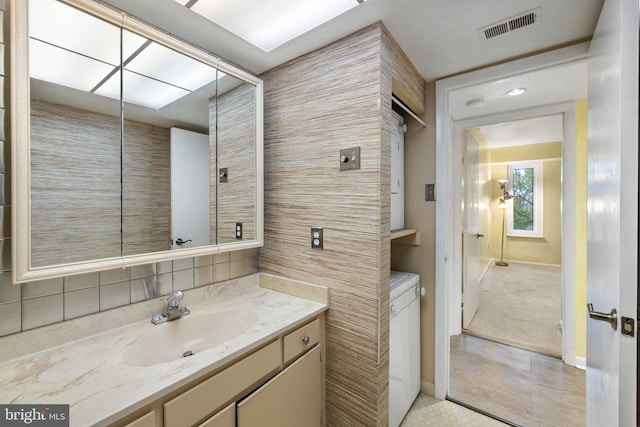 bathroom featuring vanity and tile floors