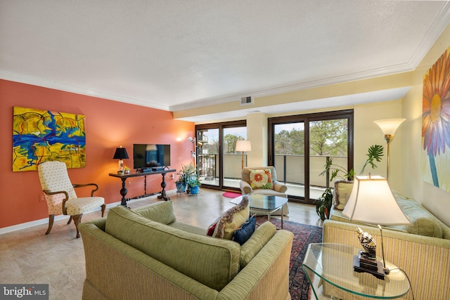 living room with ornamental molding, light tile floors, and a textured ceiling