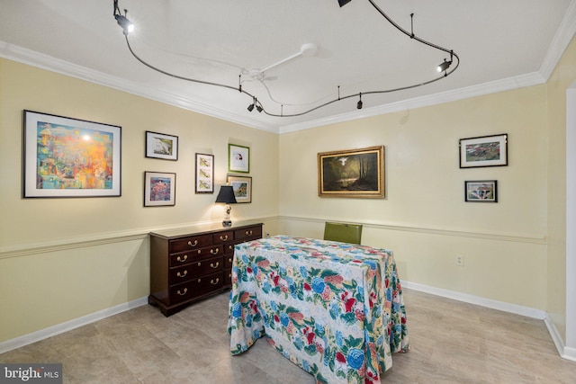 tiled bedroom with crown molding and rail lighting