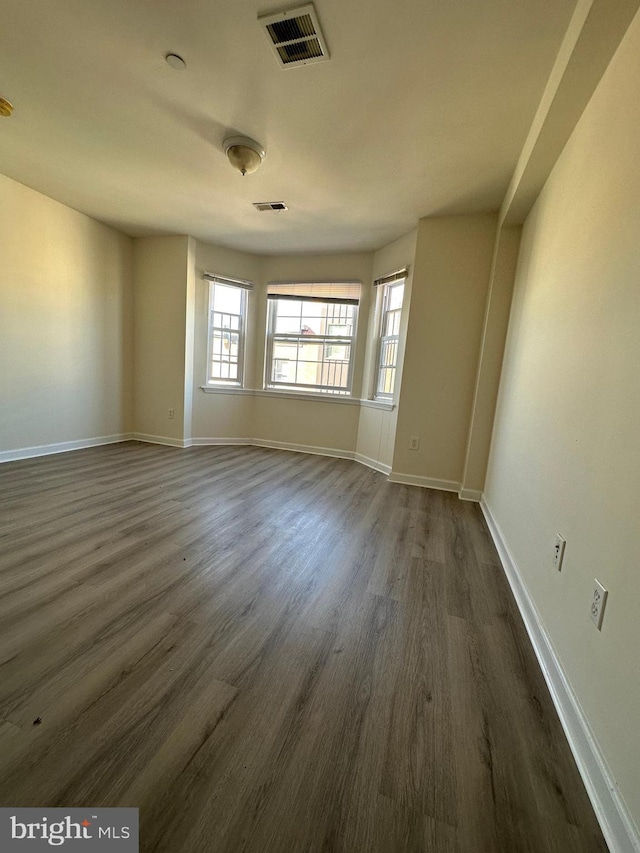 empty room featuring dark hardwood / wood-style floors