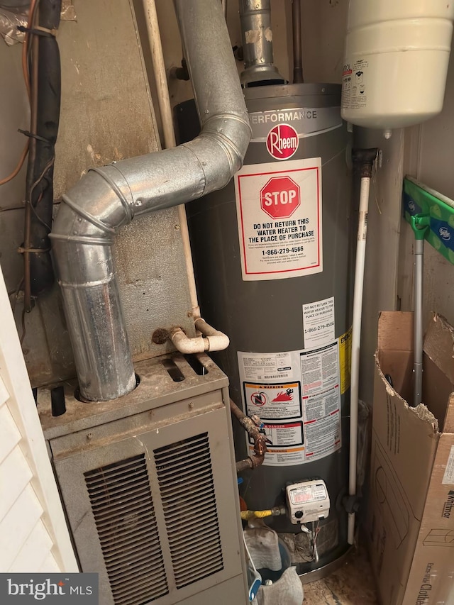 utility room featuring gas water heater