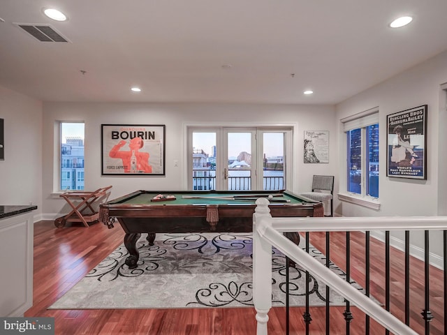 recreation room with dark hardwood / wood-style floors, plenty of natural light, and pool table