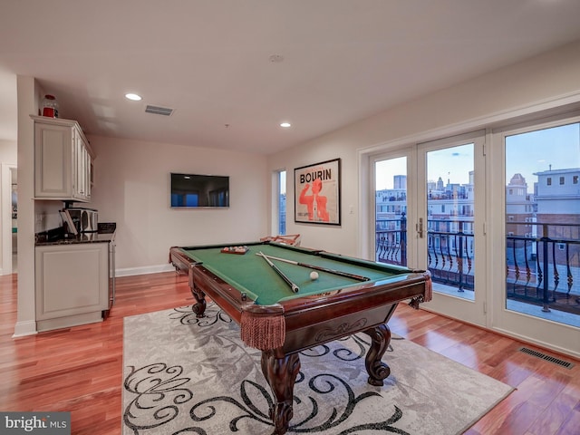 recreation room featuring light hardwood / wood-style flooring, pool table, and french doors