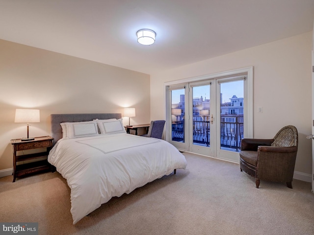 carpeted bedroom with access to outside