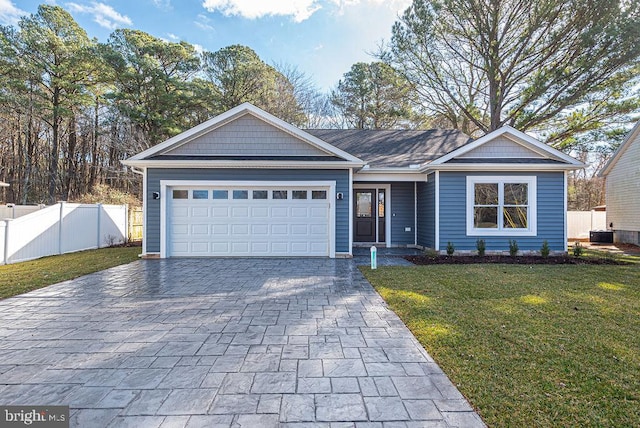 ranch-style home featuring central AC, a front lawn, and a garage