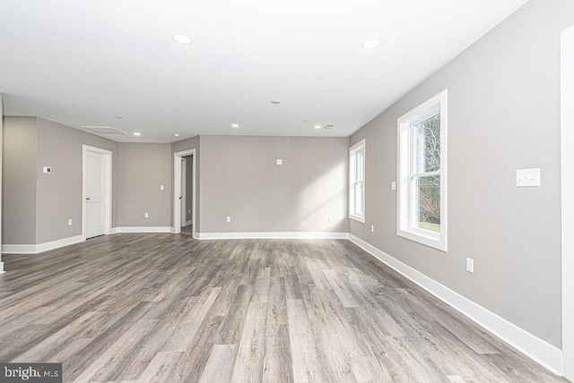 spare room with light hardwood / wood-style floors