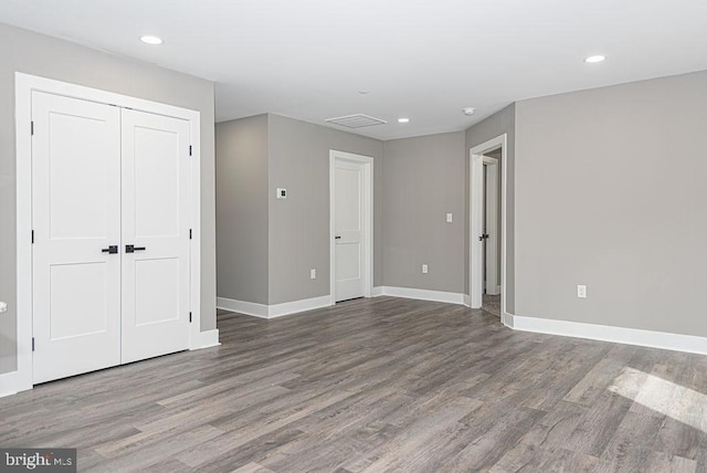 empty room featuring wood-type flooring