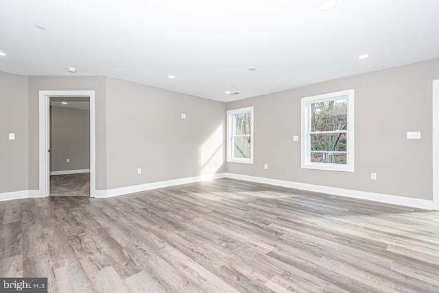 spare room with light hardwood / wood-style floors