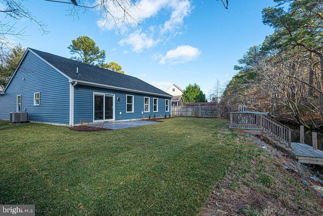 view of yard featuring central AC and a patio