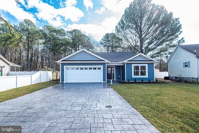 view of front facade featuring a front lawn and a garage