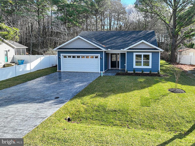 view of front facade with a front lawn and a garage