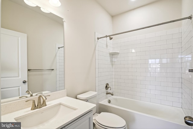 full bathroom featuring vanity, toilet, and tiled shower / bath