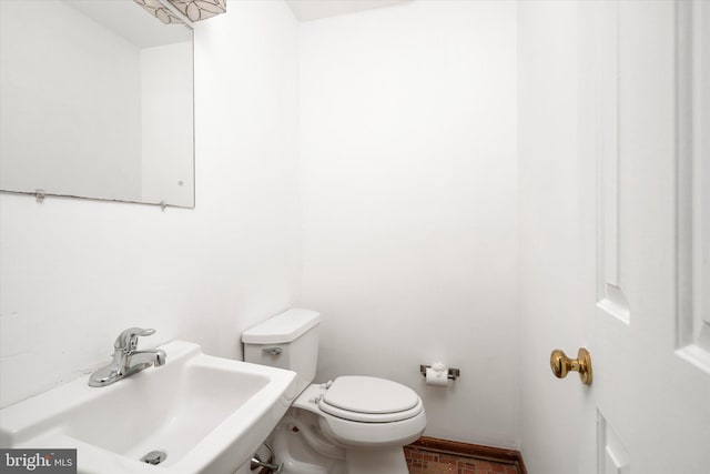 bathroom with sink and toilet