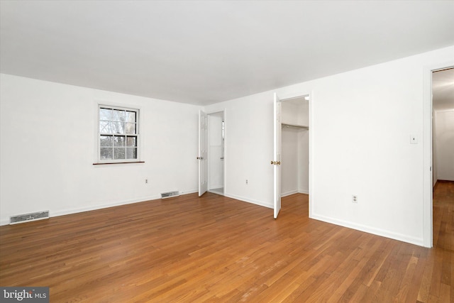 unfurnished living room with hardwood / wood-style floors