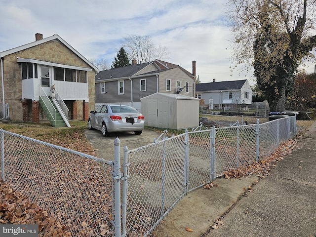 view of front facade with a storage unit