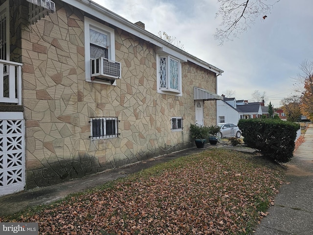 view of side of property featuring central air condition unit