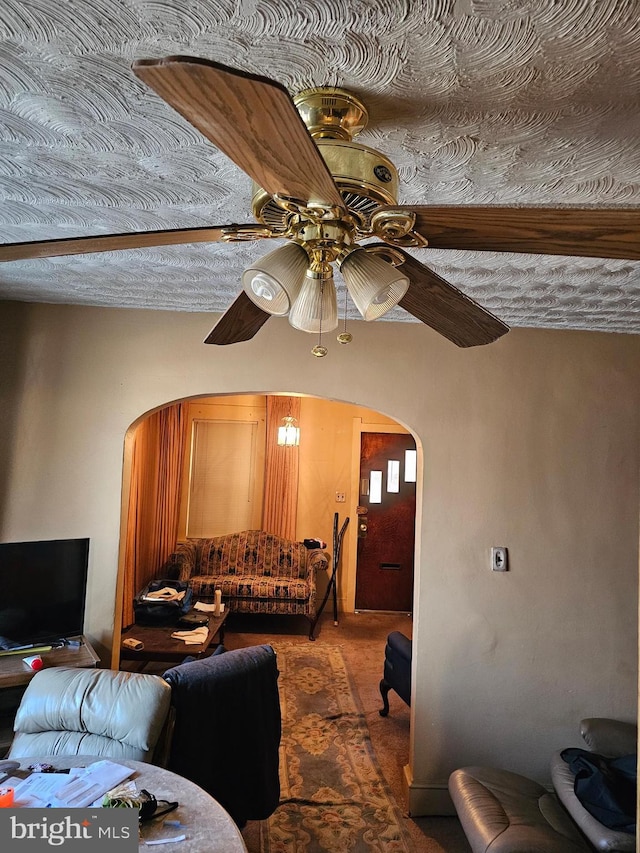 living room featuring ceiling fan