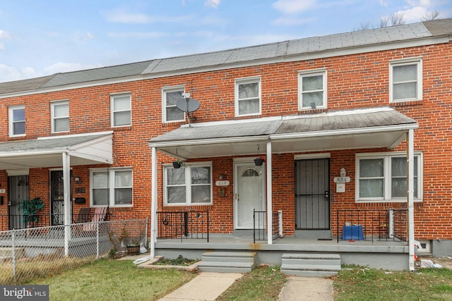 townhome / multi-family property with covered porch