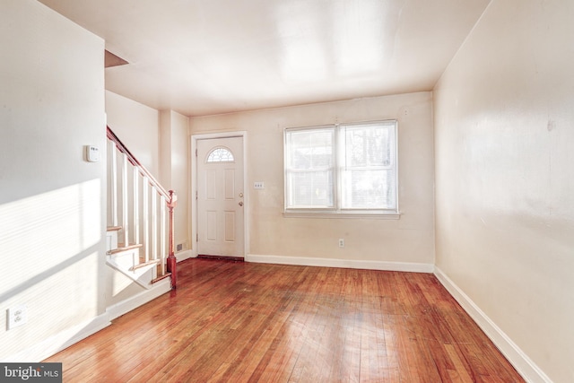 entryway with wood-type flooring