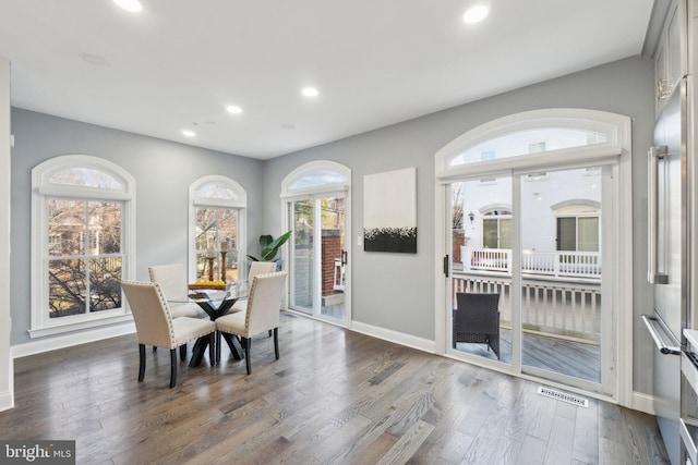 dining space featuring dark hardwood / wood-style flooring