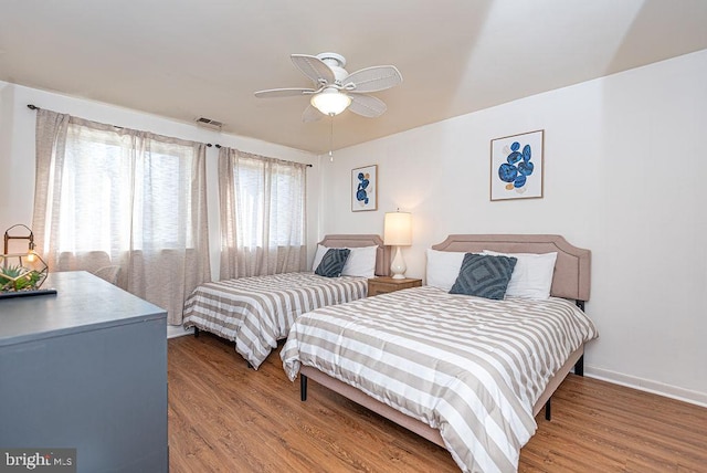 bedroom featuring light hardwood / wood-style floors and ceiling fan