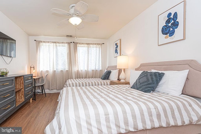 bedroom featuring wood-type flooring and ceiling fan