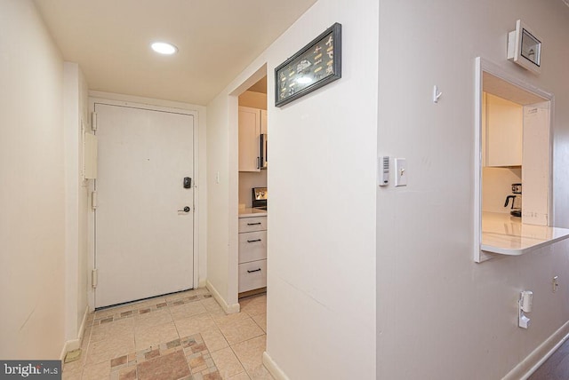 corridor with light tile floors