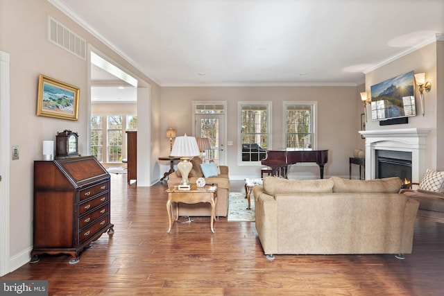 living room featuring crown molding and dark hardwood / wood-style flooring