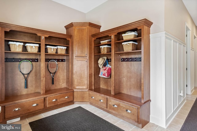 mudroom featuring light tile floors