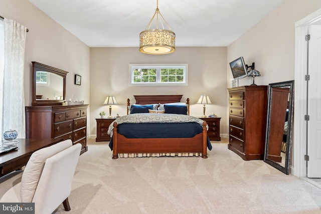 bedroom featuring light colored carpet