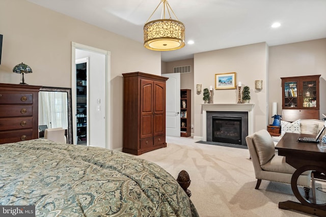 bedroom featuring light colored carpet