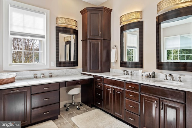 bathroom featuring tile floors and double sink vanity