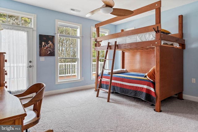 bedroom with ceiling fan and light colored carpet