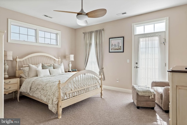 bedroom featuring ceiling fan and light colored carpet