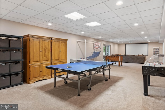 playroom featuring a paneled ceiling and light colored carpet