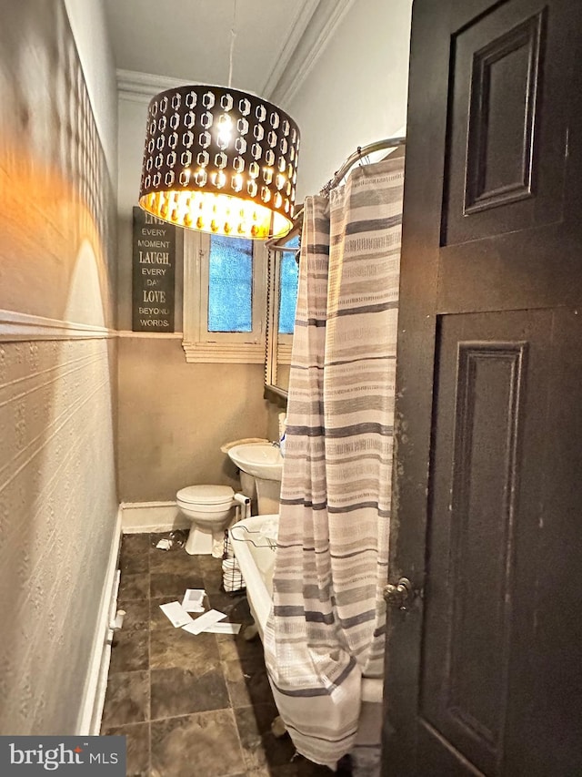 bathroom with tile flooring, ornamental molding, and toilet