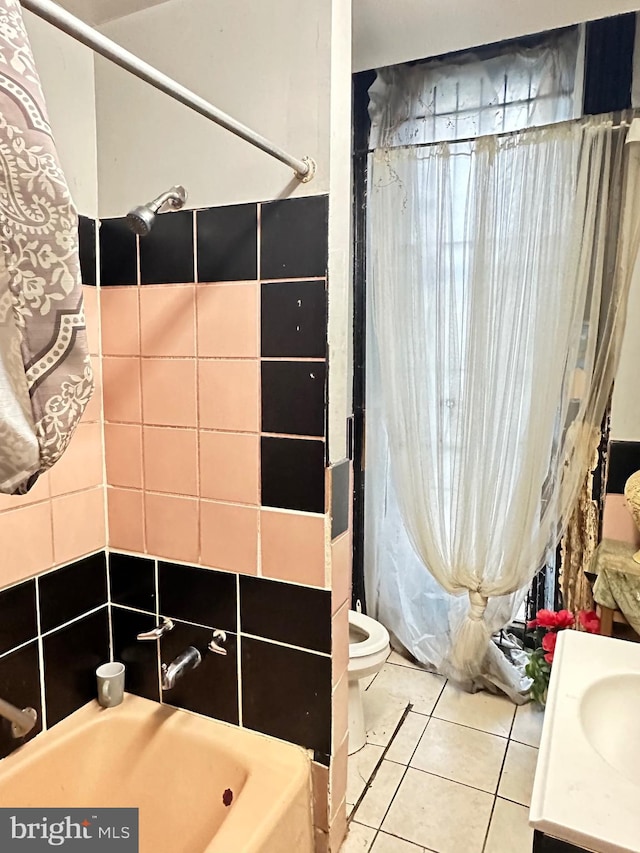 full bathroom featuring shower / bath combo with shower curtain, toilet, tile flooring, and vanity