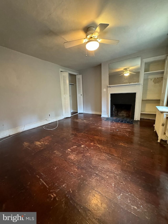 unfurnished living room featuring ceiling fan