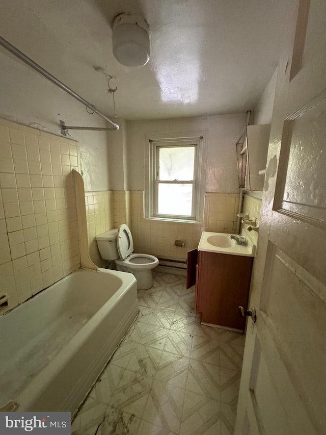 full bathroom with shower / tub combination, vanity, toilet, and tile walls