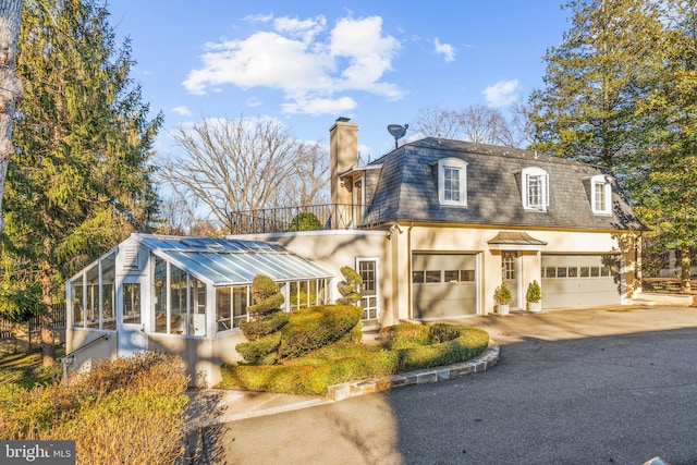 view of front of property with a garage